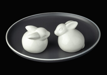 White easter bunnies on a gray plate