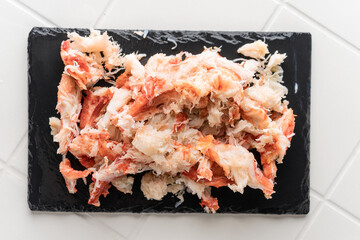 Natural crab meat without additives. Pure product. Serving on a light background