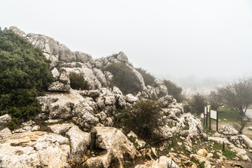 Fog at the beginning of the trail in El Torcal de Antequera, in the municipalities of Antequera and Villanueva de la Concepción. Province of Malaga, Andalusia