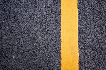 New asphalt road surface with yellow line background