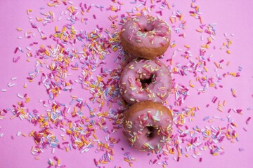 donut donuts sprinkles on doughnuts pink bright sugar strands background