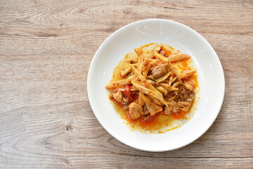 spicy stir fried bamboo shoot and chicken with curry on plate