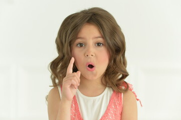 Beautiful happy girl has an idea indoors