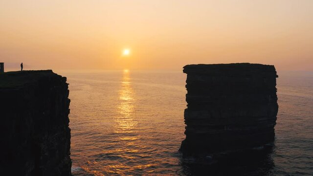 time-lapse Downpatrick Head in Ballycastle in Co. Mayo during sunset D&uacute;n Briste sea stack Cliffs	