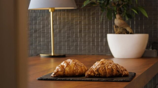 Two fresh delicious croissants on the table