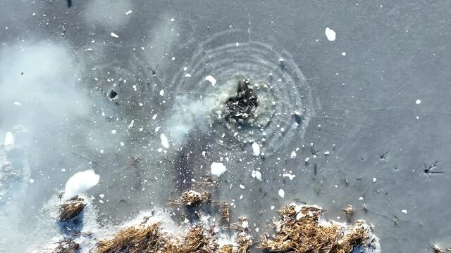 explosion petard on ice slow motion from above drone footage