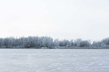 Calm winter landscape with frozen lake background