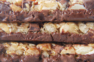 detail shot of chocolate , Almond , Raisin and oat protein bars on table 