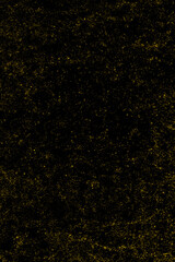 Scattered yellow grunge texture on black background