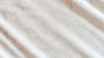 Beige gold velvet background or velour flannel texture made of cotton or wool with soft fluffy...