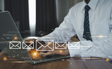 Hand Business man using Laptop  with email icon, Emails or Electronic mail spam concept. Postal envelopes icons. Digital finance technology marketing. Social media. Global customer network connection.