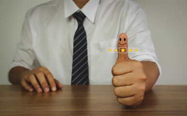 Close up finger man with happy face for rating feedback from customer service with annual survey with five gold star icon. Business annual satisfaction survey concept.User reviews and feedback online.