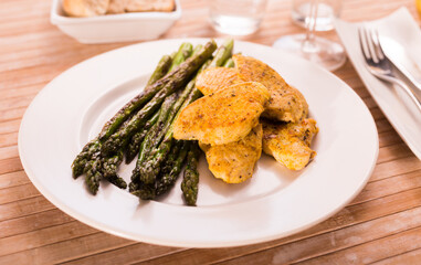 dietary meal rich in protein. Stir fried chicken breast and green asparagus