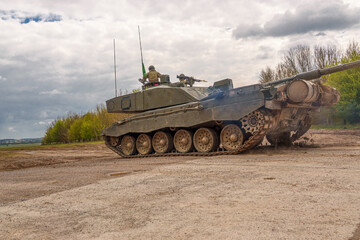 Fototapeta premium close up of a british army challenger 2 main battle tank in action on exercise on Salisbury Plain military training area, Wiltshire UK
