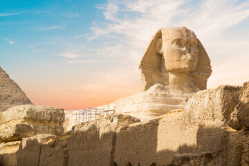 Great Sphinx against the background of the pyramids of the pharaohs Cheops, Khafren, and Mikerin in...