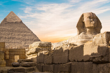 Great Sphinx against the background of the pyramids of the pharaohs Cheops, Khafren, and Mikerin in...