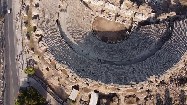 Zoom In Aerial Drone Shoot of Great Amphitheater or Colosseum in Turkey. Ancient Ruins of Antique Theatre for Gladiator Fights. Architecture of Roman Empire and Greece Era. Popular World Heritage.