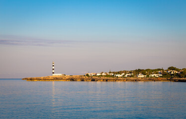 Scenic Artrutx Lighthouse at sunset in Minorca, Spain