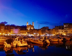 Fototapeta na wymiar Corsica, France, 25.07.2020. Harbor in the old town of Bastia at night.