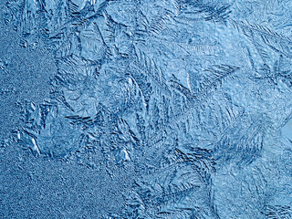 Ice crystals in the detail on a window glass in winter time