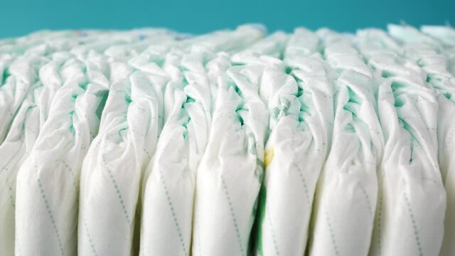 stack of baby diaper on table,