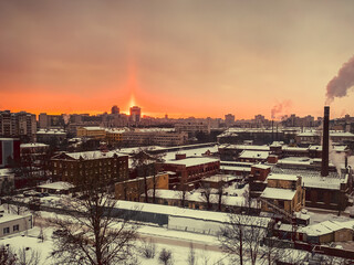 View from a frosty window on a snow-covered city in winter