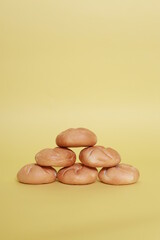 pyramid of buns on the yellow background