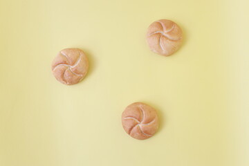 three buns on the yellow background