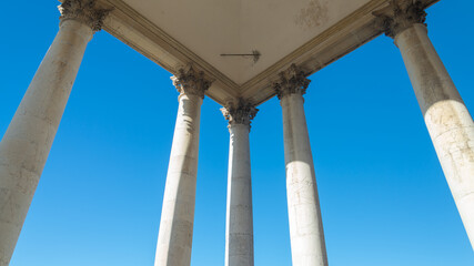 The symmetrical colonnade of the famous "Basilica di Superga" (meaning: Superga's Cathedral), close to the city of Turin, Piedmont. Italy. Blue sky on the background.