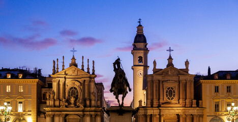 Fototapeta premium Silhouette of San Carlo Square (Piazza di San Carlo), in Torino city, Piemonte, Italy during sunset. There is the equestrian monument of Emmanuel Philibert and twin churches Santa Cristina - San Carlo