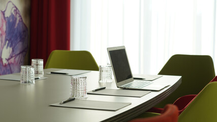 Business meeting room with wine and water glasses in a hotel in Berlin, Germany.