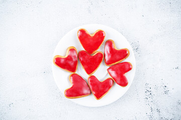 Heart shape sugar cookies with red glaze for Valentine's Day