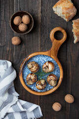 Fototapeta na wymiar Bourgogne snails,with fresh parsley, nuts and garlic