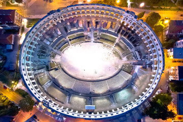Arena Pula. Ancient ruins of Roman amphitheatre in Pula aerial evening view