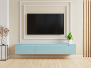 TV on the blue cabinet in modern living room on cream color wall background.