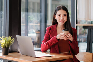 Photo of gorgeous secretary working at cafe. she sitting at the wooden desk. Accountant, fianance concept.