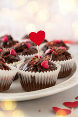 Valentine's day, chocolate homemade muffins, cupcakes with heart sprinkles.