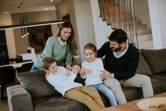 Siblings Fighting Over TV Remote Control At Home