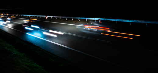 lights of moving cars at night. long exposure