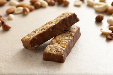 Fototapeta na wymiar Cereal bars with chocolate and nuts, healthy energy bites.