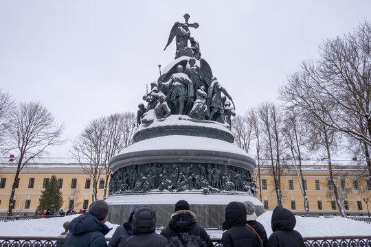 Tourists Listen To A Tour Near The Millennium Of Russia A Bronze Monument In The Novgorod Kremlin