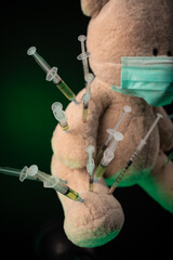 children's vaccination against the covid19 virus and vaccinations on the example of a teddy bear