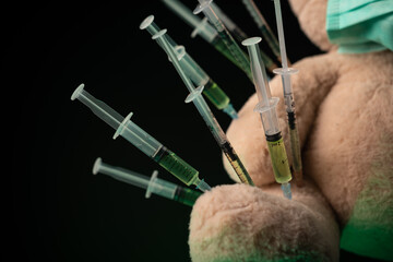 children's vaccination against the covid19 virus and vaccinations on the example of a teddy bear