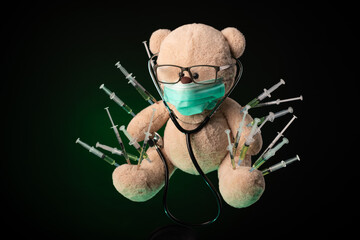 children's vaccination against the covid19 virus and vaccinations on the example of a teddy bear