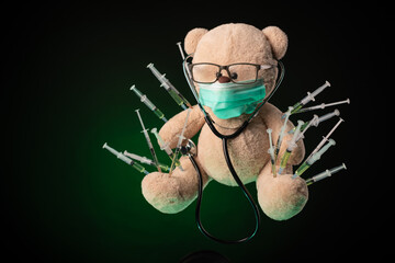 children's vaccination against the covid19 virus and vaccinations on the example of a teddy bear