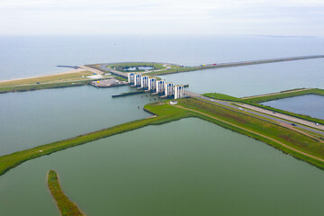 Panorama aerial view of the water flood system. IJsselmeer on the right and Markermeer on the left. Lelystad Flevopolder near Amsterdam Part of the Zuiderzeewerke. Water management. 