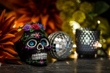 The day of the dead skull with small mirror ball and drinking glass