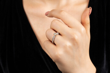 Close portrait of female model in gold and silver rings. Isolated on white background . Diamond jewelry. Diamond ring in women's hands