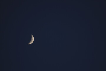 Obraz na płótnie Canvas Half moon in night sky
