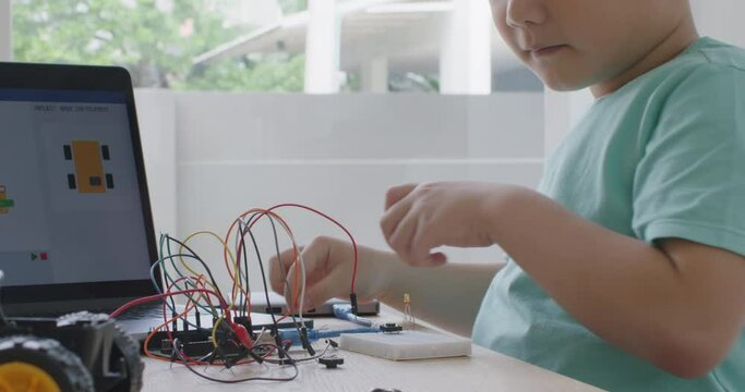 Small kid children make coding scratch car upskill STEAM lifestyle.